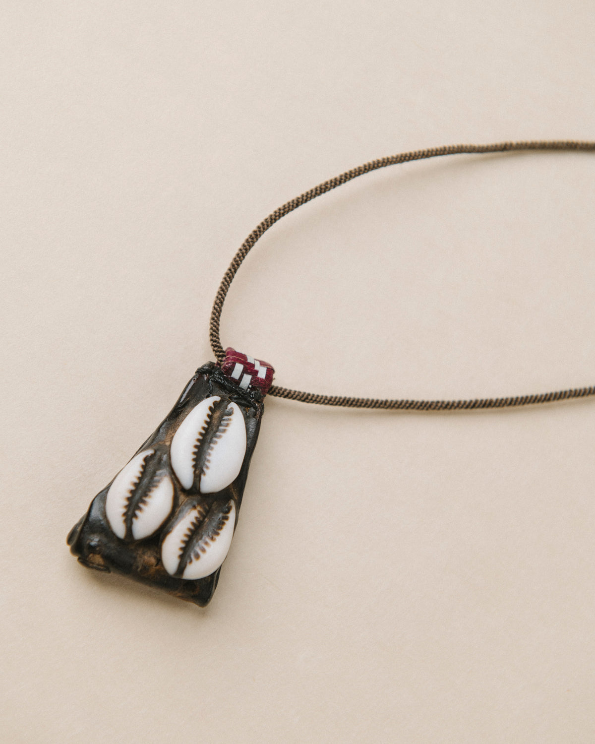 Heirloom Leather and Cowrie Shell Amulet